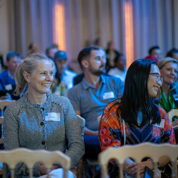 People listening to conference talk